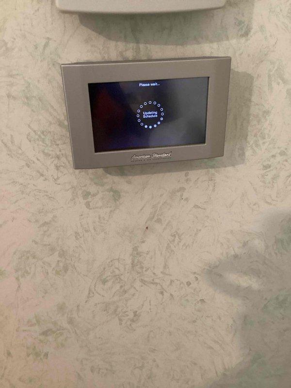 Responded to customer complaint of thermostat not maintaining set temperature, with unit cooling below the 79-degree setpoint to 73 degrees overnight. Upon inspection, found programmable thermostat with incorrect schedule settings showing wake temperature of 77 degrees and sleep mode programmed to 70 degrees, causing unintended temperature drops during nighttime hours. Reprogrammed thermostat schedule to match customer's desired comfort settings and updated system parameters to maintain consistent 79-degree setpoint throughout all time periods.