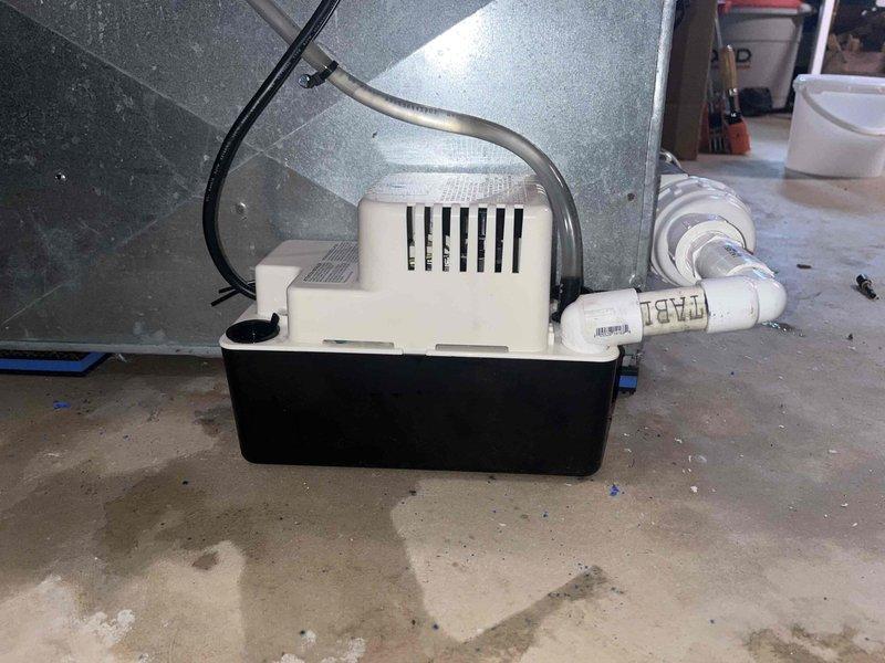Responded to service call for non-operational condensate pump on heat pump system with water overflow on floor. Upon arrival, found condensate pump failed, causing water accumulation and preventing heat pump operation. Replaced malfunctioning condensate pump unit with new assembly, verified proper drainage through discharge line, tested pump operation under load, and confirmed heat pump system restored to normal function with no further water leakage.