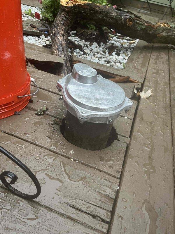 Responded to service call for damaged well cap caused by fallen tree. Upon arrival, assessed the damage to the wellhead assembly located on exterior deck area. The existing well cap sustained significant cracking and structural compromise from impact damage. Removed the damaged well cap and inspected the well casing for any additional damage or contamination concerns. Verified the integrity of the well casing and seal. Installed new replacement well cap with proper sealing to ensure sanitary protection of the water supply. Confirmed secure fit and proper function of the new cap assembly. Tested for proper seal integrity to prevent surface water infiltration and contamination of the well system.