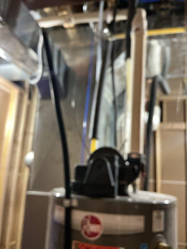 Responded to service call for elevated water and sewer utility bills at three-year-old residential property. Performed comprehensive plumbing system inspection to identify potential leaks or blockages as recommended by municipal utility provider. Conducted visual examination of water heater connections, supply lines, shut-off valves, and accessible plumbing fixtures. Inspected braided stainless steel flex lines, brass fittings, and corrugated supply hoses for signs of deterioration, moisture, or active leaks. Examined mechanical equipment in utility area including pump systems and associated piping. No visible leaks, water damage, or obvious plumbing defects detected during visual inspection. Documented findings with photographic evidence of water heater connections and utility room equipment for customer records.