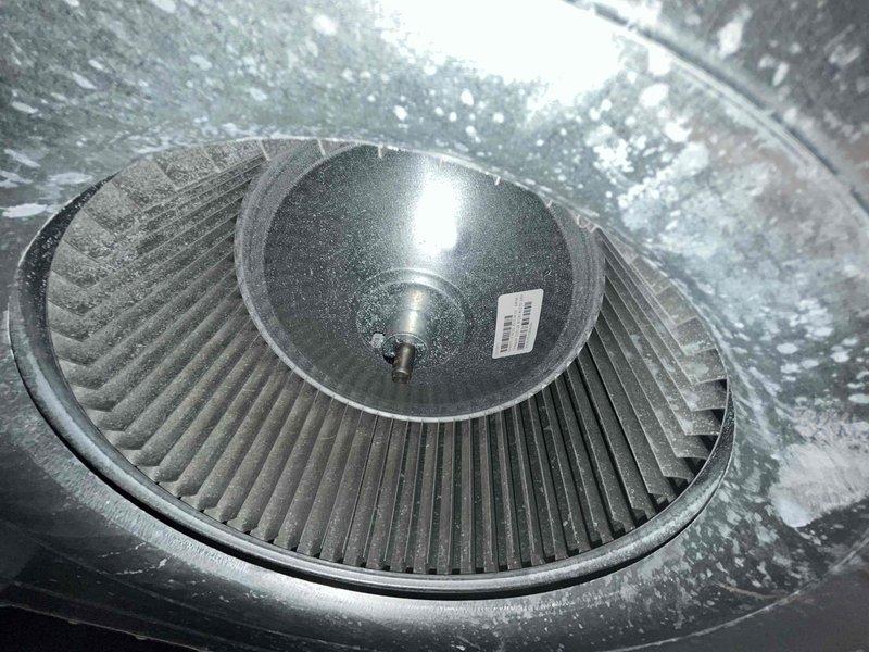 Performed comprehensive AC tune-up on residential cooling system experiencing reduced efficiency and inadequate cooling performance. Inspected and cleaned blower wheel assembly, which showed significant dust accumulation on fan blades and housing that was restricting airflow. Measured static pressure using digital manometer, recording -0.10" WC to assess system airflow and duct restrictions. Verified blower motor operation and confirmed proper rotation of centrifugal fan assembly after cleaning to restore optimal air circulation and system efficiency.