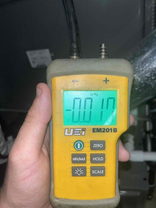 Performed comprehensive AC tune-up on residential cooling system experiencing reduced efficiency and inadequate cooling performance. Inspected and cleaned blower wheel assembly, which showed significant dust accumulation on fan blades and housing that was restricting airflow. Measured static pressure using digital manometer, recording -0.10" WC to assess system airflow and duct restrictions. Verified blower motor operation and confirmed proper rotation of centrifugal fan assembly after cleaning to restore optimal air circulation and system efficiency.