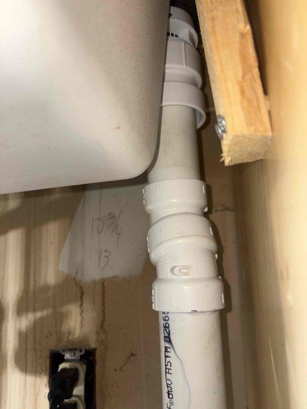Responded to complaint of foul odor originating from under kitchen sink. Upon inspection, discovered failed garbage disposal unit with deteriorated internal components causing drainage issues and malodorous conditions. Removed defective disposal assembly, cleared drain line of accumulated debris, and installed new disposal unit with proper PVC drain connections. Tested system for proper flow and verified all connections were secure and leak-free.