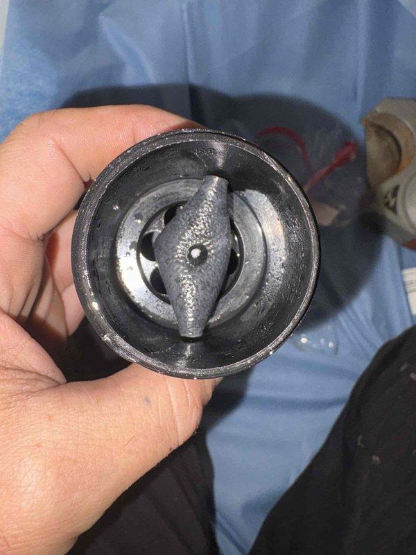 Responded to complaint of foul odor originating from under kitchen sink. Upon inspection, discovered failed garbage disposal unit with deteriorated internal components causing drainage issues and malodorous conditions. Removed defective disposal assembly, cleared drain line of accumulated debris, and installed new disposal unit with proper PVC drain connections. Tested system for proper flow and verified all connections were secure and leak-free.