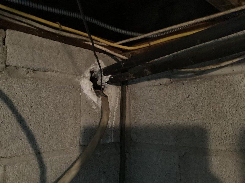 Conducted whole-house HVAC replacement estimate for 50-year-old furnace originally installed in mid-1970s and 20-year-old air conditioning unit. Assessed basement installation site with approximately four-foot ceiling height, concrete flooring, and existing equipment location. Documented electrical panel configuration showing dedicated circuits for furnace and air conditioner, evaluated existing ductwork and piping infrastructure including flexible duct runs and utility penetrations through concrete block walls, and photographed current system layout to develop comprehensive replacement proposal for both heating and cooling systems.