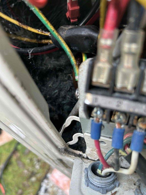 Responded to no-cool call on air handler unit that would not reset. Upon arrival, diagnosed system issue and replaced thermostat battery, which restored system operation. Customer requested to convert service call to preventative maintenance tune-up. Performed complete system inspection of outdoor condensing unit and air handler, including electrical connections, refrigerant levels, and component operation. Documented equipment condition with photos showing electrical terminal connections and outdoor unit. System tested and confirmed operating properly following battery replacement and tune-up completion.