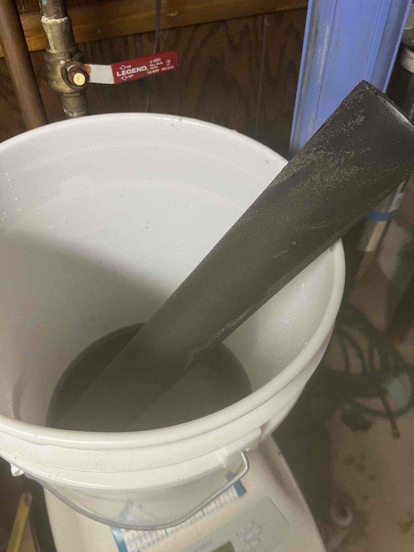 Conducted on-site evaluation of existing water softener system in response to water quality issues and visible staining throughout the home. Assessed current equipment condition, reviewed previous estimate for replacement system, and documented existing plumbing configuration including pipe insulation showing moisture accumulation and basement utility connections. Photographed water staining evidence in fixtures and evaluated overall water treatment needs for property built in 1975.
