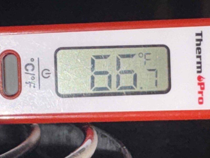 Responded to service call regarding tanked water heater experiencing increased energy consumption and reduced hot water duration. Upon inspection, measured outlet water temperature at 66.1°F, significantly below optimal performance standards. Assessed current system efficiency and discussed heat pump water heater upgrade options with property owner to improve energy efficiency and hot water capacity. Documented existing equipment condition with photographic evidence for service records.