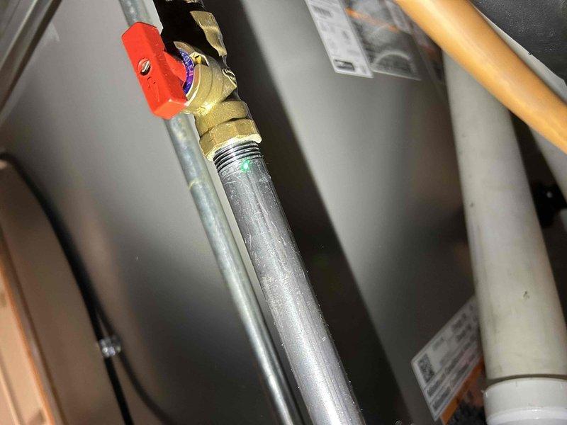 Responded to service call for AC unit causing excessive vibration throughout residence during startup. Upon inspection, measured gas pressure at manifold using digital manometer, recording readings of 0.26 and 0.5 inches water column at dual ports. Verified gas supply valve operation and inspected associated piping connections to HVAC equipment. Documented equipment conditions and pressure measurements to determine cause of vibration issue during compressor engagement.
