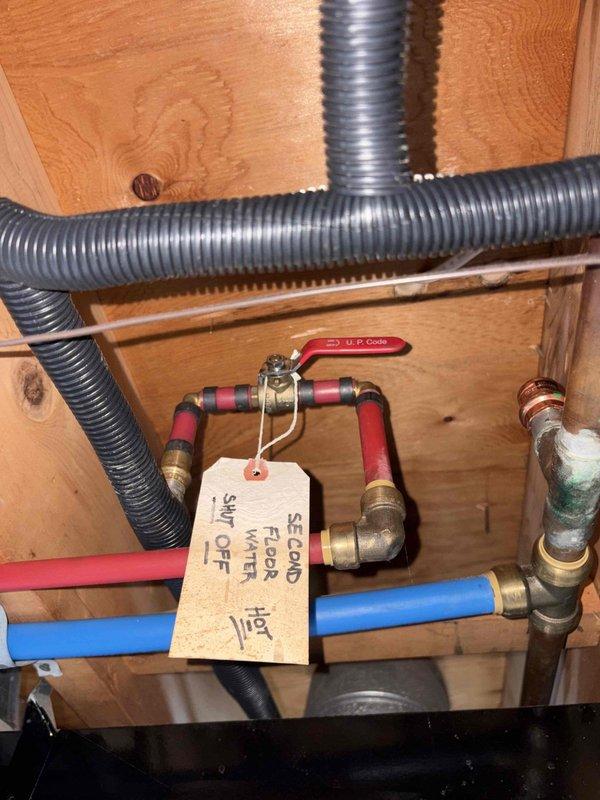 Conducted comprehensive assessment of existing HVAC equipment and water heater for replacement estimate. Inspected approximately 20-year-old air conditioning system, 20-year-old conventional storage water heater, and furnace of undetermined age. Evaluated ductwork in attic space, noting condition of metal supply ducts and insulation. Examined plumbing infrastructure including hot and cold water supply lines with PEX piping, shut-off valves, and copper connections showing oxidation. Documented existing equipment specifications, installation configurations, and access points. Photographed current system components and infrastructure to support itemized replacement proposals for air conditioner, water heater, and furnace as separate line items per customer request.