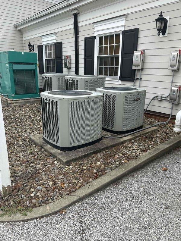 # HVAC Service Report

Responded to no cooling complaint for intake room system. Upon arrival, performed diagnostic testing on multi-unit residential HVAC installation consisting of three condenser units positioned on concrete pads. Connected Fieldpiece SMAN refrigerant manifold and micron gauge to affected unit to measure system pressures and temperatures. 

Diagnostic readings indicated abnormal pressure differential with high-side pressure measuring 312 psig and discharge temperature at 134°F, while low-side pressure registered 323 psig at 100°F. These readings confirmed refrigerant system imbalance affecting cooling capacity. Performed complete system evaluation including electrical disconnect verification, refrigerant charge analysis, and compressor operation assessment to restore proper cooling function to intake room.