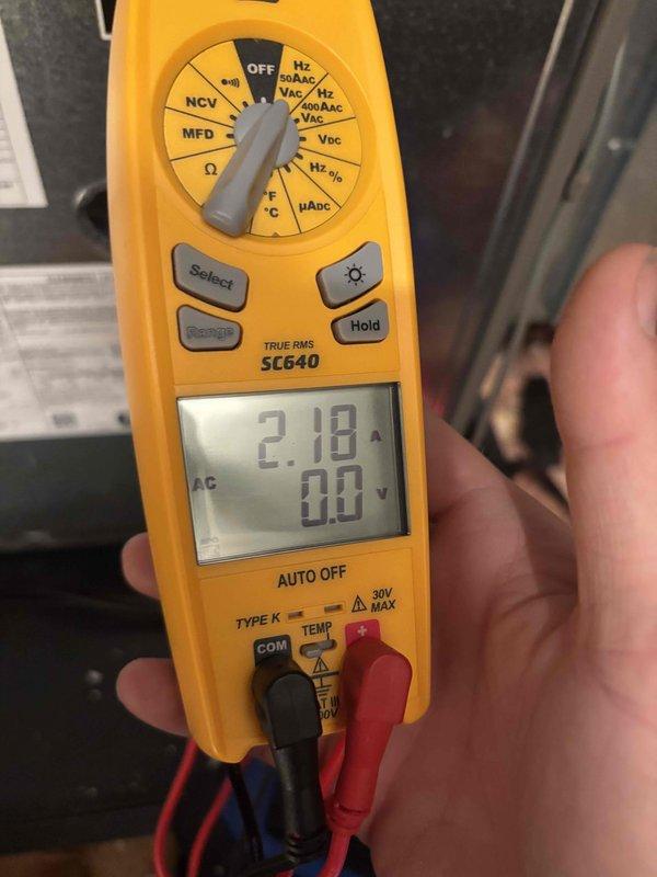 Completed routine air conditioning tune-up on a 10-year-old dual-zone system with two compressor units serving the downstairs and upstairs areas. Performed comprehensive maintenance inspection including filter examination, electrical testing with multimeter confirming proper voltage readings at 218V AC, and system diagnostics on both units. All components operating within normal parameters with no issues identified during the two-hour preventive maintenance service.