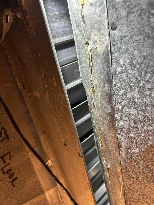 Returned to property to complete zoning system diagnostics on air handler unit located in attic space. Performed comprehensive evaluation of zoning control system, including inspection of damper operation, zone control panel functionality, and wiring connections. Examined air handler unit and associated ductwork for proper airflow distribution across multiple zones. Verified zone damper positioning and confirmed proper communication between thermostat controls and damper actuators. Inspected ductwork connections at zone transitions and assessed condition of supply plenums. Documented system configuration with photographs showing air handler installation, ductwork arrangement, and zone register locations. System evaluated and diagnostic findings provided for zoning performance optimization.