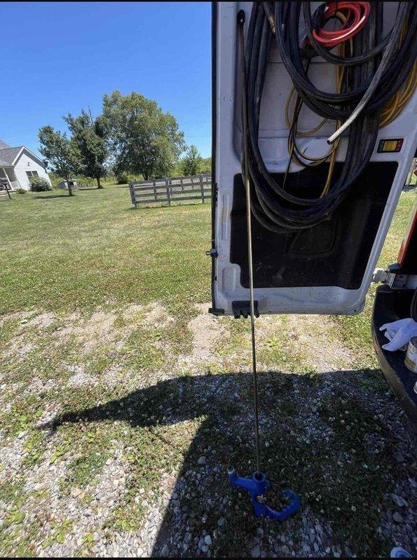 Responded to callback for exterior hose bibb that was previously repaired but continued leaking with increased severity. Upon arrival, inspected outdoor spigot mounted on wooden fence post and identified failure of previous repair attempt. Diagnosed faulty valve mechanism and improper seal causing water discharge. Replaced defective valve assembly, installed new compression washer, and tested spigot under full pressure to verify complete leak elimination. System now functioning properly with no water loss detected.