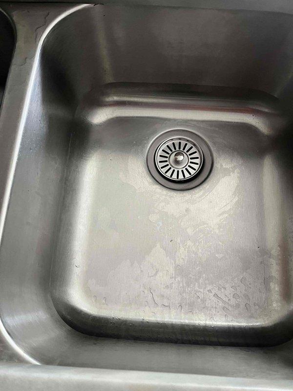 Performed water heater flush on 13-year-old tanked unit and assessed overall condition to help determine remaining service life. Additionally installed new garbage disposal unit under kitchen sink, completing all plumbing connections and verifying proper operation of the disposal system and drain assembly.