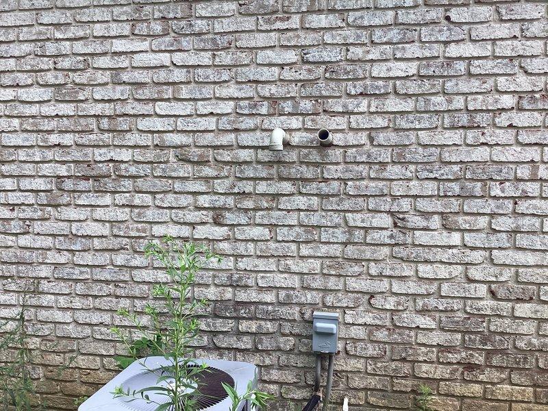 Conducted estimate for replacement of furnace unit located above three-car garage that sustained water damage during winter months, resulting in ice buildup rendering system inoperable. Assessed existing HVAC infrastructure including multiple heating and cooling units on property, documented current air filtration system specifications (20x20x1 pleated filters), and evaluated exterior mechanical penetrations and electrical connections to determine replacement requirements and compatibility with existing ductwork and utilities.