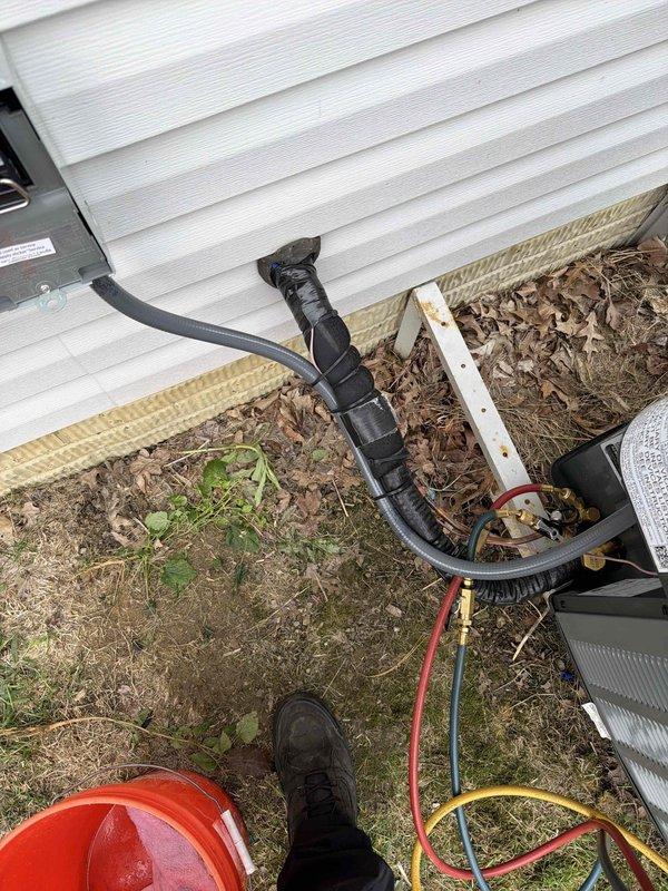 Completed full HVAC system installation including new air conditioning unit and evaporator coil. Installed refrigerant lines with proper insulation and securing, made all necessary refrigerant connections using manifold gauge set, and performed system evacuation to verify proper vacuum levels at 11.54 microns. System was charged, tested, and confirmed operational with all connections leak-free and properly sealed.