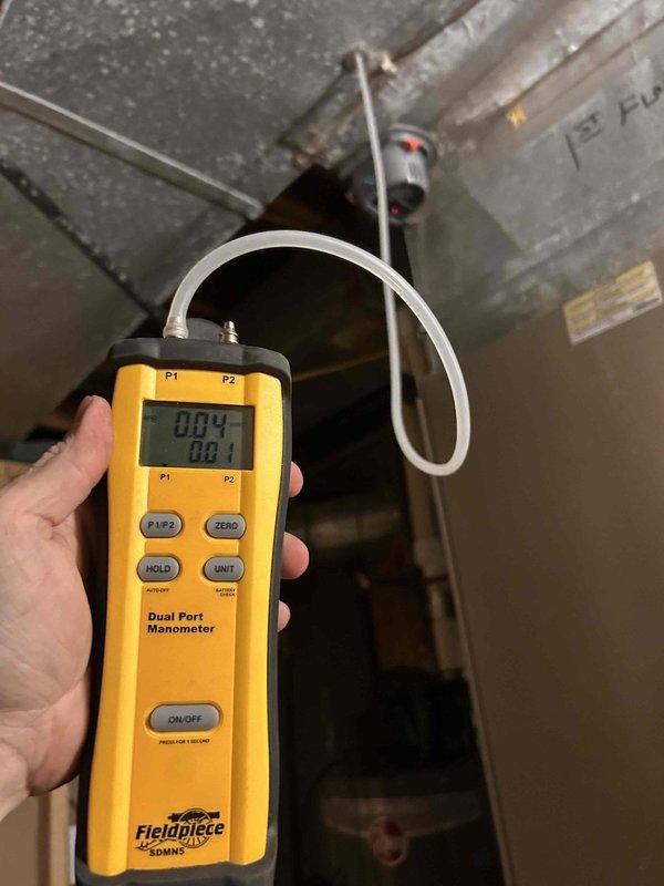 Responded to call for AC unit running continuously without cycling off. Performed system diagnostics including pressure measurements using digital manometer to verify proper airflow and static pressure levels within ductwork. Inspected motorized damper operation and confirmed proper functioning of zone control system with adequate electrical connections intact.