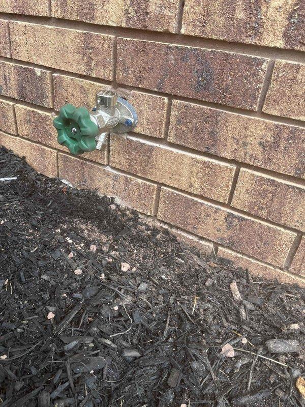 Completed spot repairs and hose bib replacement at residential property. Installed new exterior hose spigot with chrome-plated body and green plastic valve handle, properly mounting unit to brick exterior wall. Performed attic plumbing repairs including copper pipe connections with compression fittings and secured flexible PEX lines (red and blue) to wooden joists using appropriate fasteners. All work completed with assistant over four-hour service period, ensuring proper water flow and leak-free connections throughout the system.