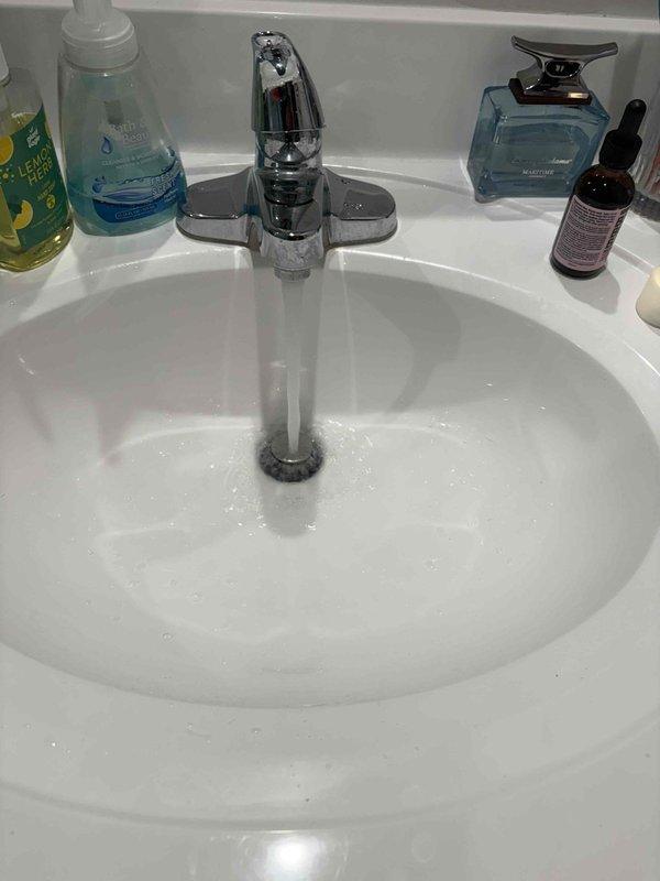 Returned to property to complete lavatory faucet replacement. Installed new chrome single-handle faucet on bathroom vanity sink as previously sold. Materials were received via purchase order 76775564. Verified proper water supply connections, tested faucet operation for flow and temperature control, and confirmed no leaks at supply lines or drain assembly. Installation completed successfully with fixture functioning as specified.