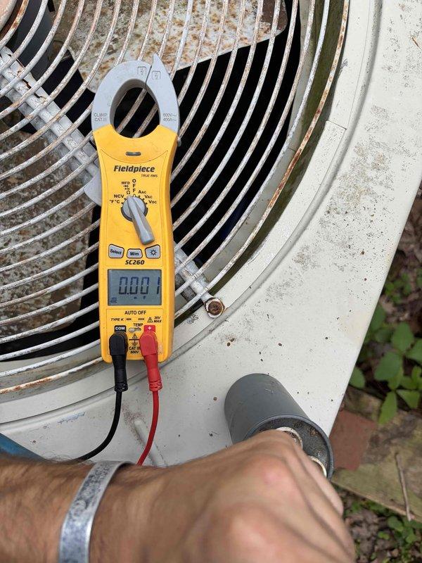Responded to no-cooling call on Bard 4-ton AC unit that had tripped breaker. Upon inspection, identified failed dual-run capacitor with severe terminal corrosion and oxidation. Replaced defective capacitor, verified proper amperage readings with clamp meter, and confirmed system operation. Unit restored to normal cooling function with breaker holding steady.