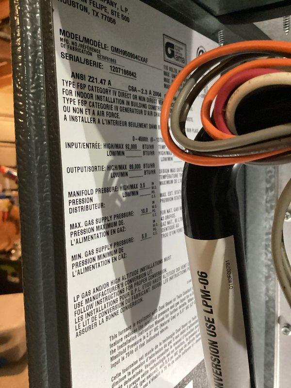 Responded to service call for AC system experiencing rapid ice formation on condenser and refrigerant lines with loss of cooling capacity. Evaluated 13-year-old Goodman system showing signs of refrigerant restriction or evaporator coil failure causing continuous freeze-thaw cycles despite customer's attempts at cleaning condenser fins and system resets. Documented existing equipment specifications including furnace model GMAUFR080ACXAC and photographed current installation configuration. Provided comprehensive replacement options and estimates for complete system upgrade due to age of equipment and severity of cooling failure affecting entire home.