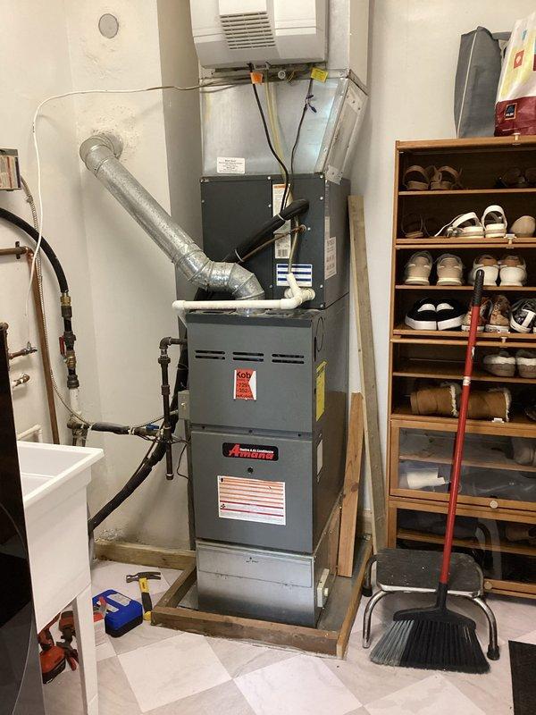 Conducted comprehensive HVAC replacement consultation for residential property with existing gray Amana furnace system rated at 80% AFUE efficiency. Evaluated current equipment condition, ductwork configuration, and utility room layout to provide multiple replacement options including standard contractor-supplied equipment packages and alternative pricing scenarios for customer-supplied furnace installation. Discussed equipment specifications, system sizing requirements, and installation considerations for the basement utility space that houses the furnace alongside water heater and connects to existing ductwork infrastructure.