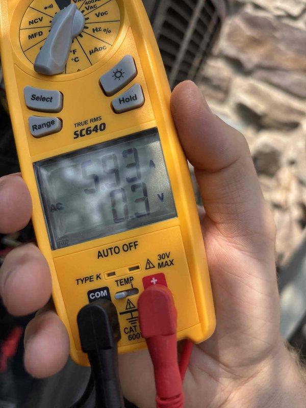 Completed routine cooling maintenance member visit on HVAC system. Performed electrical diagnostics using digital multimeter, measuring voltage readings of 179.9V and 12.3V, as well as amperage readings of 199A to verify proper system operation and electrical component functionality. All measurements documented photographically for service records.