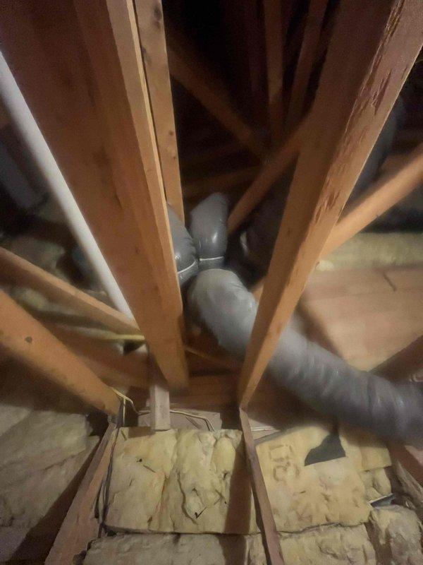Conducted comprehensive HVAC system evaluation for complete replacement estimate on 20+ year old gas furnace and existing air conditioning system. Assessed current equipment condition, ductwork configuration including PVC condensate drain lines and flexible duct routing through attic space, and insulation conditions surrounding HVAC infrastructure. Documented existing semi-operational AC units and provided recommendations for full system replacement to improve efficiency and reliability.