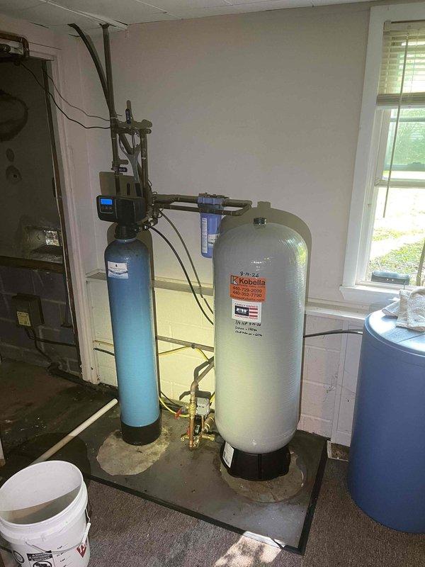 Responded to low/no water pressure complaint affecting multiple fixtures throughout the residence. Upon inspection, diagnosed issue related to the existing water filtration system consisting of a dual-tank setup with Robella softener and pre-filter assembly. Addressed system malfunction causing inadequate water flow to various faucets, restored proper water pressure and flow rates to all affected fixtures, and verified system operation through testing at multiple points of use.