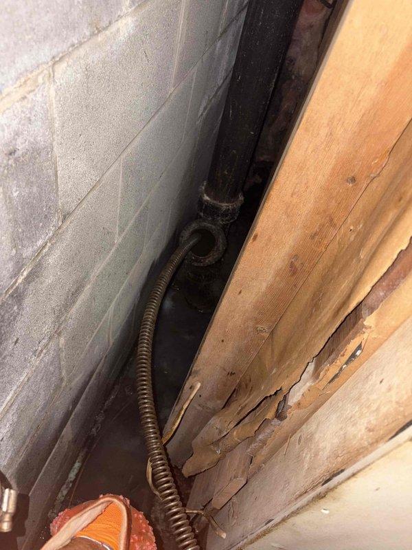 Responded to emergency call for basement flooding caused by uncapped pipe following recent plumbing work. Upon arrival, confirmed active water leak creating flooding conditions in basement area. Utilized inspection camera equipment to diagnose source of water intrusion and assess plumbing system integrity within wall cavity and structural chase spaces. Located missing pipe cap on open plumbing line, which was the direct cause of continuous water discharge into basement. Secured and properly capped the open pipe terminus to stop active leak. Inspected surrounding copper piping, conduit runs, and adjacent plumbing infrastructure within wall chase to ensure no additional damage or compromised connections. Verified proper installation of cap and confirmed complete cessation of water flow. Documented conditions with diagnostic camera showing interior pipe conditions and structural cavity arrangement. Emergency flooding mitigated successfully with proper pipe termination restored.