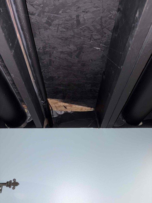 Responded to service call for air conditioning system not cooling properly with condensation present on refrigerant lines. Upon inspection, found 13-year-old AC unit showing signs of age-related wear and declining performance. Assessed indoor furnace and air handler components in basement mechanical room, evaluating ductwork connections and refrigerant line insulation. Examined attic access area to inspect additional HVAC infrastructure and copper refrigerant piping routing. Provided comprehensive system evaluation and presented replacement estimate for complete HVAC system upgrade to restore proper cooling capacity and efficiency.