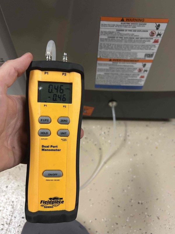 Responded to complaint of loud noises and system strain from indoor air handler unit. Performed diagnostic assessment using digital manometer to measure static pressure across the system, revealing elevated pressure differential readings. Inspected air handler cabinet and filter assembly, finding restricted airflow through the filtration system. Addressed airflow restriction issue to restore proper system operation and reduce mechanical strain on the equipment.