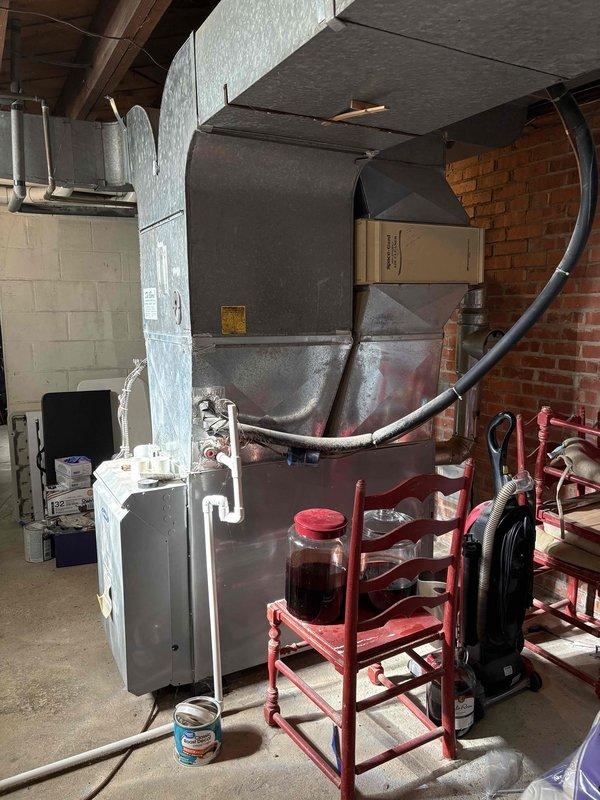 Conducted on-site assessment for heat pump and oil furnace replacement system. Evaluated existing heating equipment, including current oil-fired furnace and domestic water heater installation in basement mechanical room. Documented electrical service panel configuration with existing circuit breakers to determine capacity for new heat pump system installation. Assessed ductwork connections, utility room layout, and structural considerations for equipment replacement and provided comprehensive estimate for dual-fuel heating system upgrade.