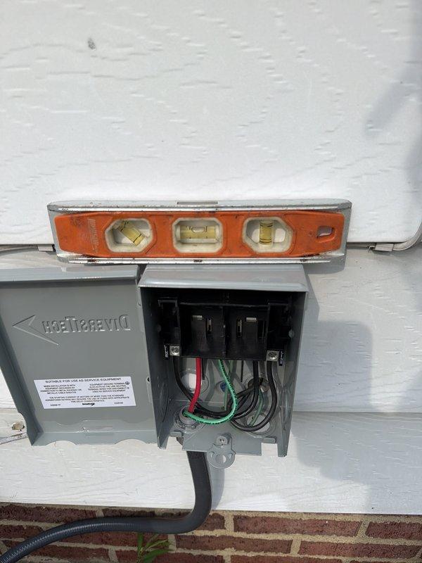 Completed full HVAC system installation including outdoor condensing unit with new electrical disconnect box, contactor relay assembly, and associated wiring connections. Installed and leveled exterior electrical disconnect on building exterior wall with proper conduit routing, verified all electrical connections secure, and tested system operation to ensure proper functionality of all components.