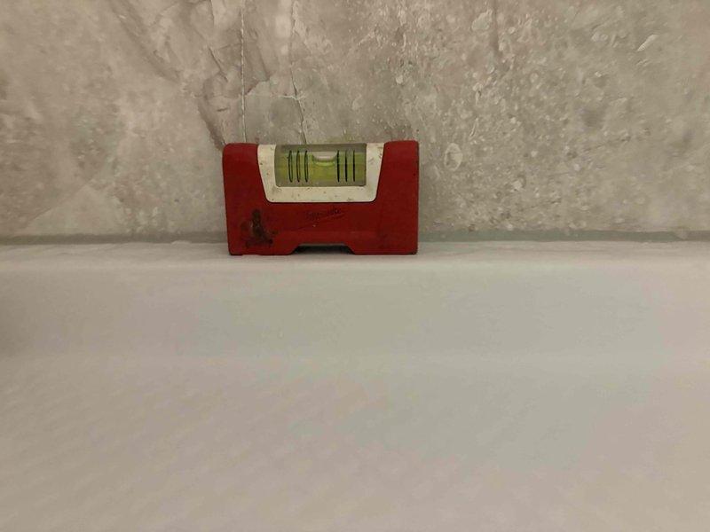 Responded to service call for recurring leak on wall-mounted toilet fixture in half bath. Upon inspection, assessed the condition of the existing installation and surrounding area to determine the extent of water damage and underlying issues causing repeated failures. Documented current state of fixtures and flooring for comprehensive bathroom remodel estimate. Evaluated structural conditions, wall integrity, and flooring surfaces to provide accurate scope of work for complete half bath renovation that will address chronic leaking issues and prevent future water damage.