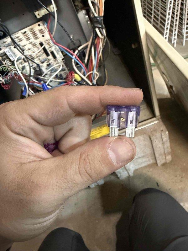 Responded to no cooling call on residential air conditioning system. Upon arrival, found blown 3-amp fuse on control board preventing system operation. Performed voltage testing at contactor and control board terminals to verify electrical continuity and proper power distribution. Replaced defective fuse and restored system to normal operation. Verified thermostat communication and confirmed unit cycling properly with adequate cooling output.