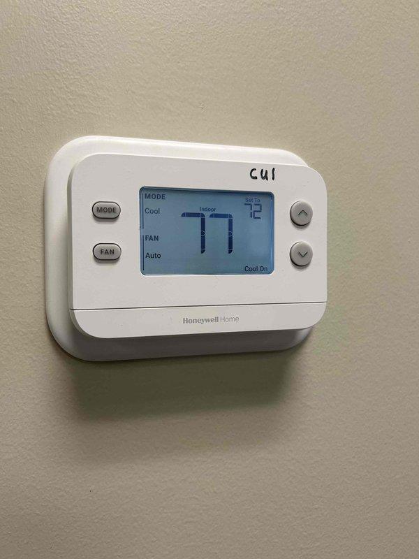 Responded to service call for non-operational air conditioning system. Upon arrival, inspected thermostat wiring and connections, finding all terminal connections properly secured and wiring intact. Verified thermostat functionality with unit calling for cooling at setpoint of 72°F while indoor temperature displayed 77°F. System diagnosis required to determine if issue relates to refrigerant charge levels or dirty evaporator coil restricting airflow and heat transfer.