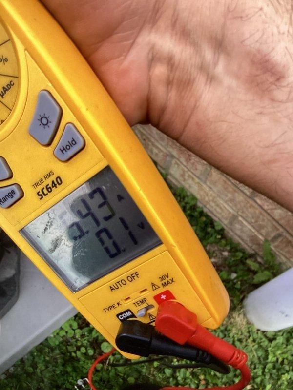 Completed air conditioning tune-up on air handler unit. Performed temperature diagnostics using calibrated digital multimeter, recording ambient conditions and verifying proper system operation. Measured supply air temperatures showing 47.9°F dry bulb with 82.5% relative humidity and 42.8°F dew point, indicating adequate cooling performance and proper refrigerant charge. System operating within normal parameters with no deficiencies noted.