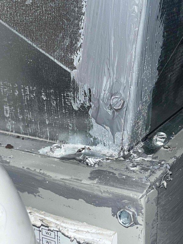 Returned to air handler location to address ductwork deficiencies identified during previous inspection. Applied mastic sealant around ductwork joints and seams where air leakage gaps were present. Sealed metal duct connections at corner junctions and vertical transitions to ensure proper system air tightness and prevent conditioned air loss.