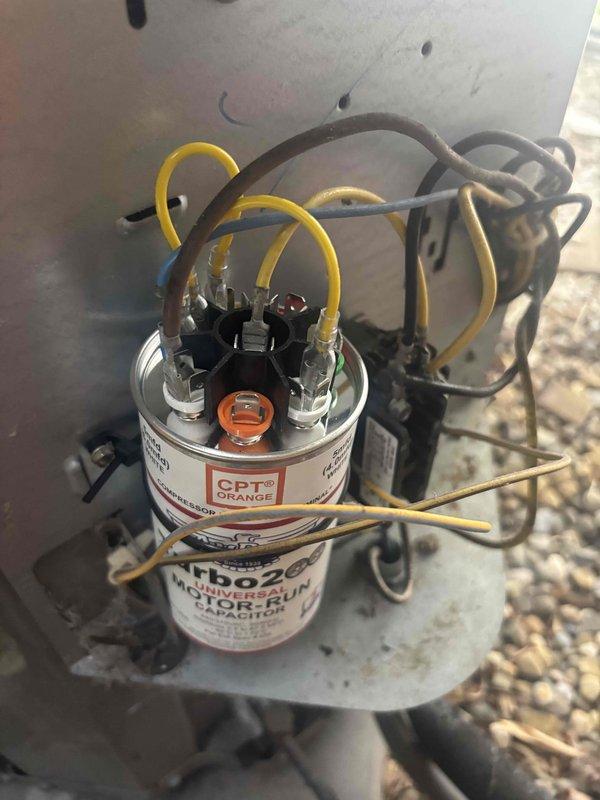 # HVAC Service Report

## Customer Complaint
Customer reported air conditioning system not producing cold air, outdoor fan not operating, and whistling noise occurring shortly after unit startup. Issue affected cooling throughout entire home.

## Diagnostic Findings
Responded to no-cool complaint on residential air conditioning system. Upon arrival, confirmed outdoor condensing unit fan motor was inoperative. Performed visual inspection of outdoor unit components and identified failed run capacitor as primary issue.

## Testing and Measurements
Used digital multimeter to test capacitor functionality. Capacitor tested outside acceptable microfarad range, confirming component failure. Verified voltage supply to unit was within normal operating parameters at standard residential service voltage. Capacitor failure explained both the inoperative condenser fan motor and subsequent whistling noise, which was caused by compressor attempting to operate without proper fan motor operation and air