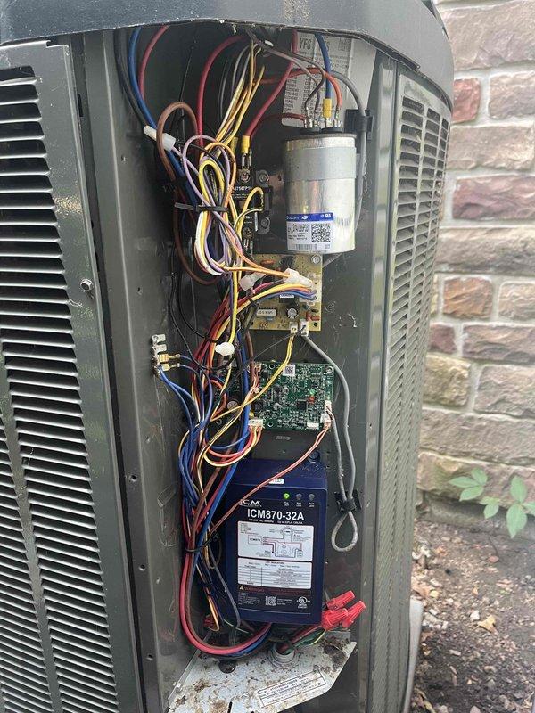 Returned to property to perform leak search on air handler unit as previously sold. Accessed outdoor condensing unit and inspected all refrigerant connections, electrical components, and internal assemblies. Conducted thorough visual inspection of compressor, capacitor, contactors, and control board. Examined refrigerant lines and fittings for signs of oil residue or corrosion that would indicate refrigerant leakage points. Documented unit condition with photographs showing interior components and wiring configuration for service records.