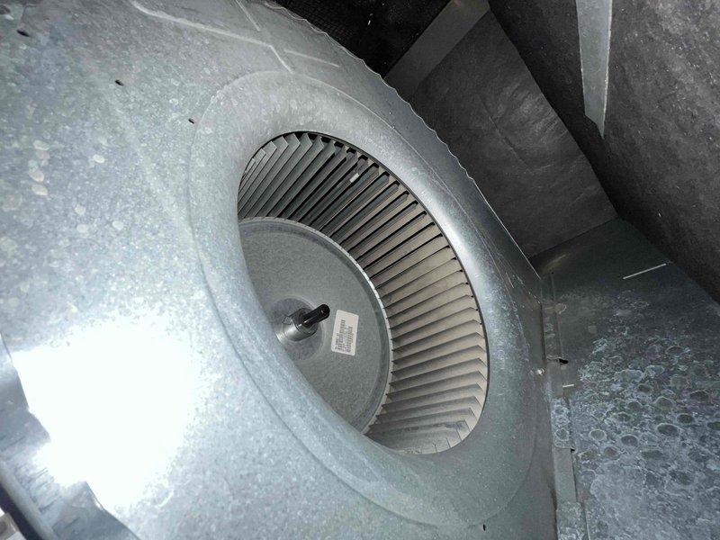 Responded to call regarding blower motor running erratically on 2007 Rheem HVAC system. Upon inspection, diagnosed failed blower motor bearings causing uncontrolled fan operation. Removed and replaced complete blower assembly including motor and squirrel cage fan wheel due to bearing failure and excessive wear. System tested and restored to normal operation with proper airflow and quiet performance.