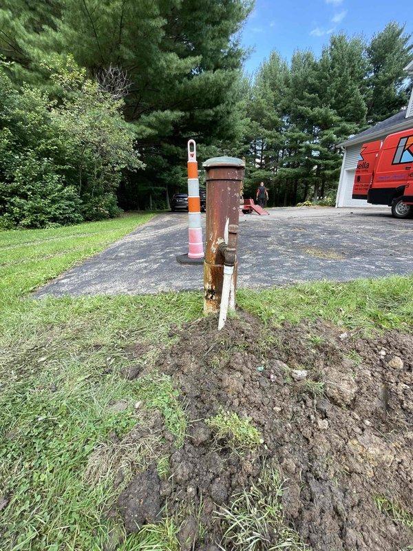 Excavated and installed new downspout discharge line and cleanout assembly. Dug trench from foundation to discharge point, installed PVC drainage pipe with proper slope for water flow, and set cleanout access point for future maintenance. Backfilled excavation and restored work area upon completion.