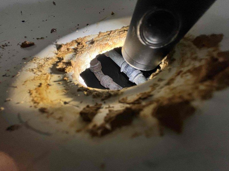 Responded to a partial drain clog in a 1948-built residential bathroom. Upon inspection, accessed the drain line through an existing ceiling access point, revealing evidence of age-related buildup and deterioration in the original galvanized plumbing system. Successfully cleared the obstruction and restored proper drainage flow to the bathroom sink.