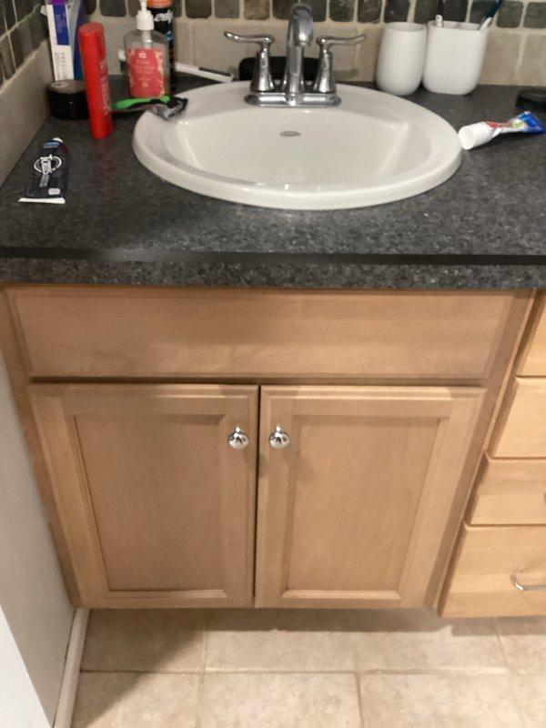 Performed camera inspection on kitchen sink drain line to diagnose clog located below garbage disposal unit. Video inspection revealed blockage in drain line, documented findings with photographic evidence of affected sink and surrounding plumbing fixtures for service records.