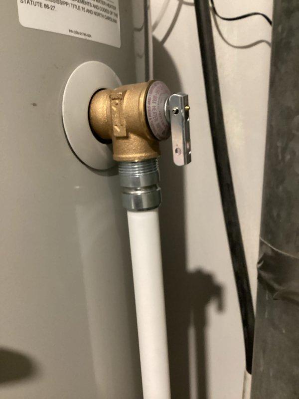 # Emergency Plumbing Service - Standing Water Resolution

Responded to emergency call for standing water in residence. Upon arrival, assessed forty-year-old plumbing system experiencing drainage issues causing water accumulation within the home. Performed diagnostic inspection of kitchen sink drainage system and associated plumbing connections.

Inspected double-basin stainless steel sink installation with contemporary fixtures including pull-down faucet and soap dispenser. Examined drain assemblies in both basins and traced drainage lines to identify blockage source. Evaluated water heater connections and shut-off valve assembly, noting brass elbow fitting with PEX piping configuration to ensure no related leaks contributing to standing water issue.

Successfully cleared clogged drain obstruction, restoring proper water flow and eliminating standing water condition. Tested both sink basins for proper drainage function and verified all connections remained secure with no active leaks. 