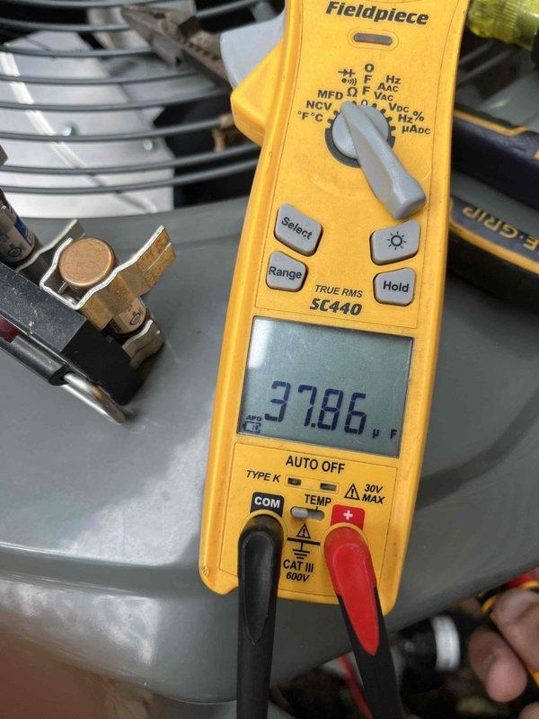 Completed preventative maintenance club visit on residential cooling system. Performed comprehensive electrical diagnostics using Fieldpiece SC440 meter, verified capacitor performance reading 3786 microfarads on Genteq dual run capacitor model D15R1422P16. Inspected all electrical connections, tested voltage and amperage on compressor and condenser fan circuits, and confirmed proper operation of all system components. Unit operating within manufacturer specifications.
