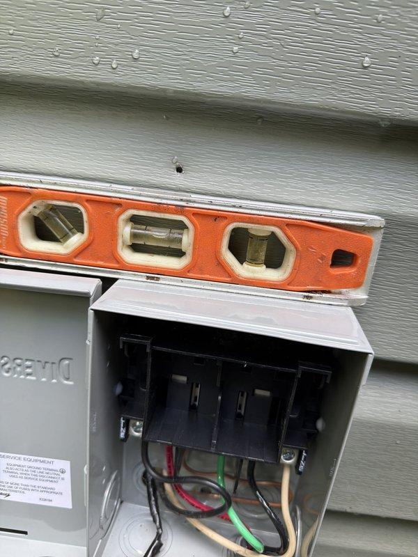 Completed installation of new air conditioning system. Installed outdoor condensing unit on ground-level pad with proper clearances for airflow and serviceability. Ran and terminated electrical supply line from new outdoor disconnect box mounted on exterior wall. Verified disconnect box installation level and secure to structure. Installed appropriate dual-fuse disconnect assembly rated for 208-230V AC with TR15R time-delay fuses for equipment protection and code compliance. Made all electrical connections per manufacturer specifications and local electrical codes. Tested unit startup, verified proper amperage draw, and confirmed system operation. Installation complete and operational.