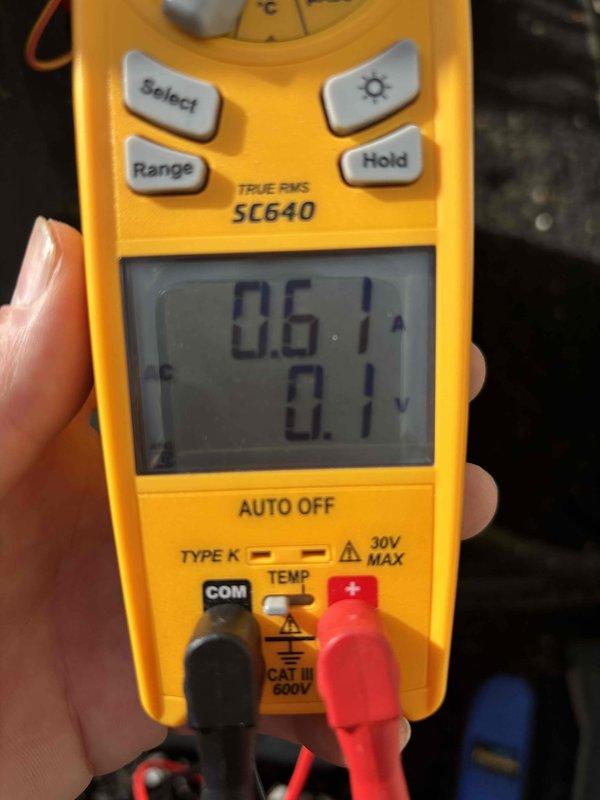Completed club maintenance visit on air handler unit. Performed standard diagnostic testing using digital multimeter to verify system electrical parameters. Measured and recorded amperage draw of 0.61 amps and temperature reading of 75°F to confirm proper system operation. All electrical components tested within normal operating range. Unit operating as designed with no issues identified during inspection.